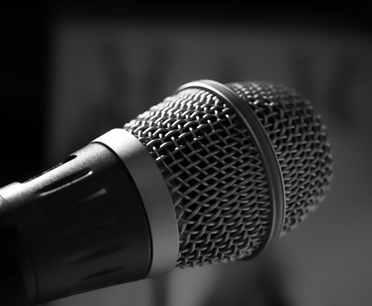 Black and white microphone, symbol of expression and vocal power.