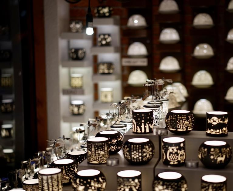 Decorative lanterns illuminate the room with enchanting patterns, creating a magical atmosphere.